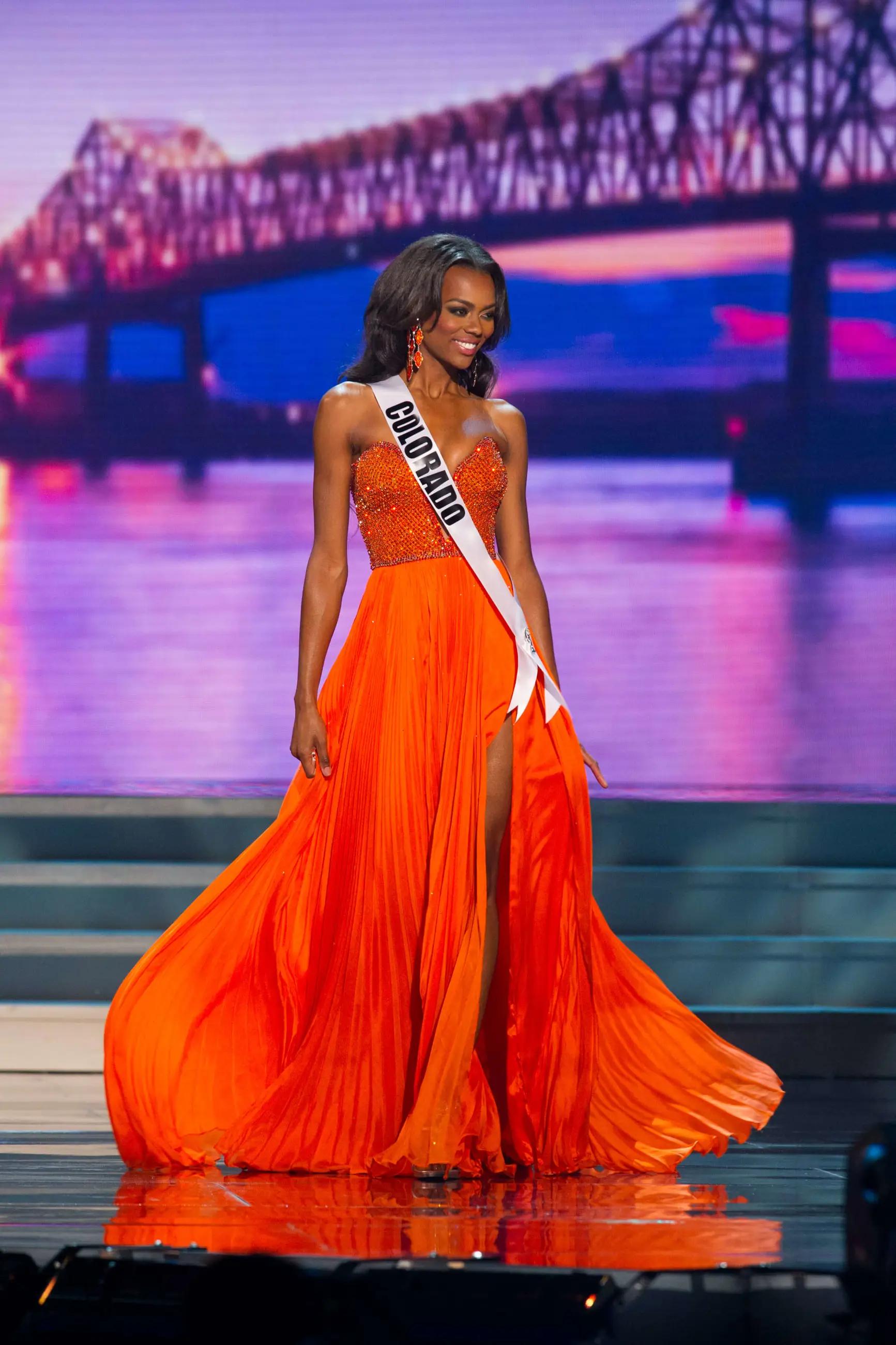 Long orange pageant gown by Sherri Hill Couture in Denver, Colorado at TBC Occasions